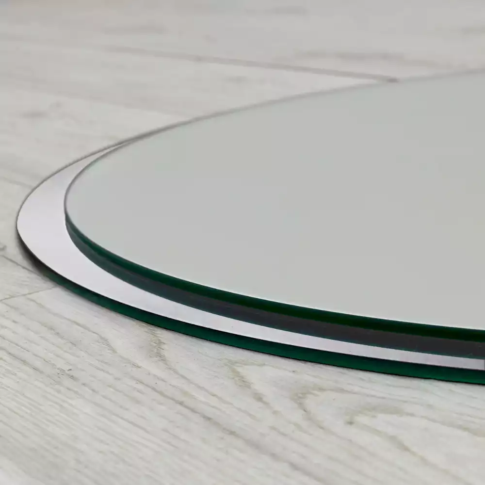 Okrągłe lustro wiszące w białej ramie